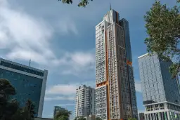 The Nest One tower and neighbouring office buildings in Tashkent